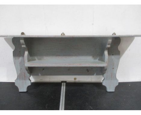 A grey painted shelf unit