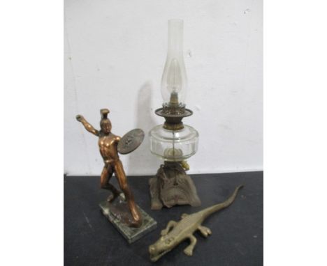 A converted oil lamp, Grecian warrior figure and a brass crocodile