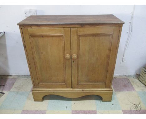 A pine two door cupboard