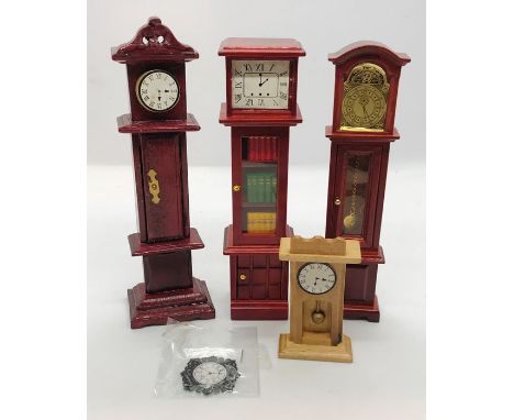 Three doll house long case clocks along with a mantle clock etc