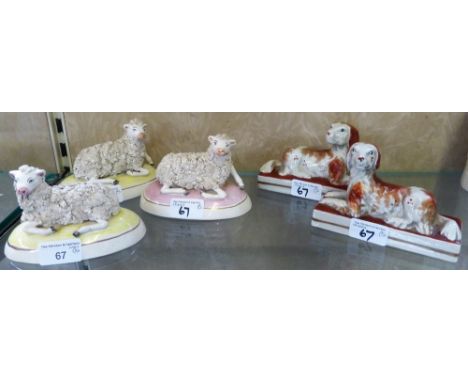 Three staffordshire sheep together with a pair of ceramic dogs (5)