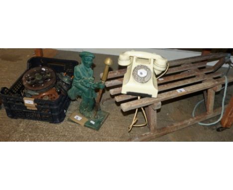 Vintage fishing reels, child's sleigh, vintage telephone and a figural fireside companion in the form of a golfer (4)