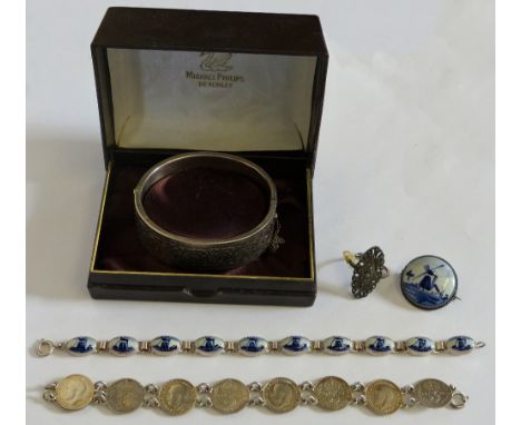 A silver hinged bangle with floral engraved front, a 3d coin bracelet, a Delft panel link bracelet and other jewellery