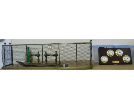 Brass fire kerb, irons and stand together with a set of four board mounted ship style instruments, including clock, barometer