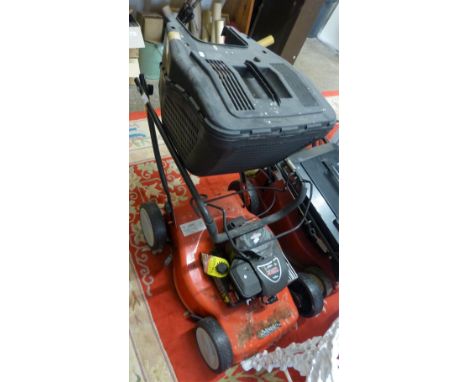 A Sovereign petrol driven lawnmower with Briggs and Stratton 148cc engine