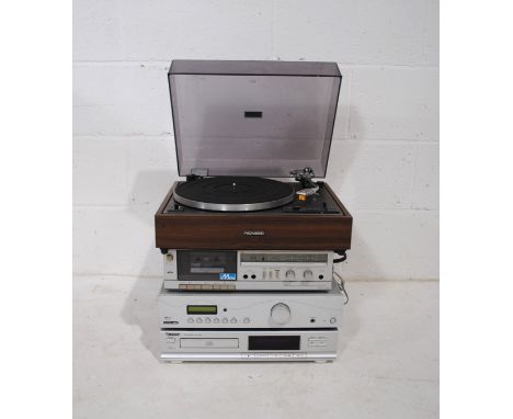 A vintage stacking hi-fi system, comprising a Pioneer PL-12D belt-drive turntable, Sharp RT-12 cassette player, Acoustic Solu