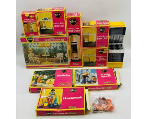 A collection of nine vintage boxed Pedigree Sindy accessories including Eastham E-Line Sink Unit, Hob Unit, Floor Cupboard, W