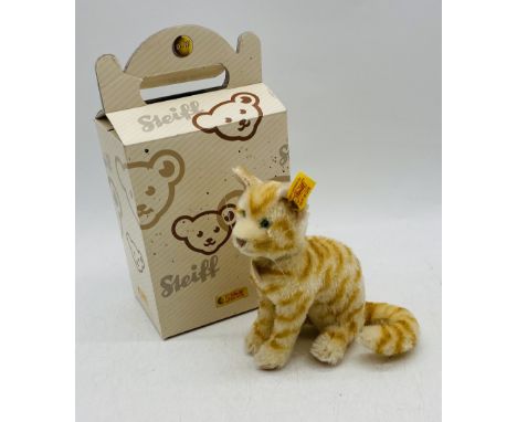 A boxed Steiff "Tapsy" cat with mohair, glass eyes and labels (not attached)