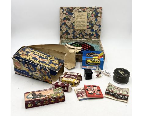 A collection of vintage toys including Johnson Disney projector, Matchbox car, solitaire etc. 