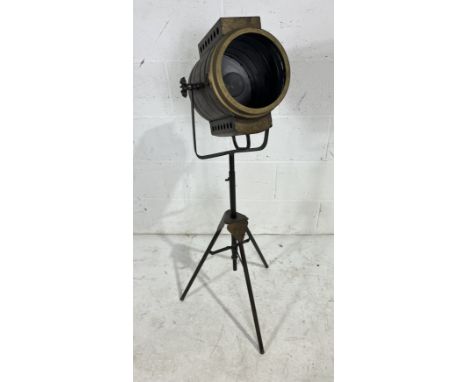 A vintage industrial spotlight style floor lamp, battery powered, height adjustable.