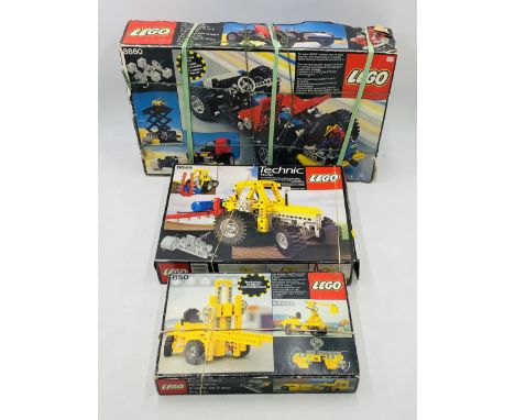 Three boxed vintage Lego Technic sets including Car Chassis (8860), Tractor (8849) and Forklit (850) - contents unchecked 