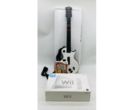 A boxed Wii games console with Wii Sports included, along with Wii guitar with Guitar Hero Legends of Rock 3 - all untested