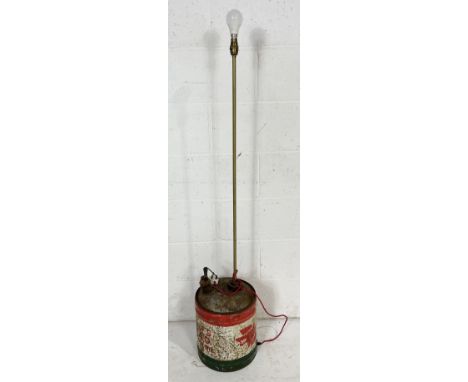 A industrial lamp made from a vintage Wolf's Head oil drum