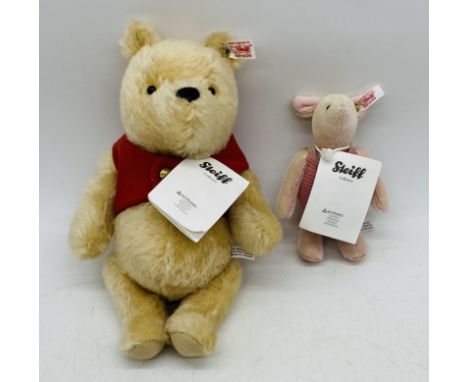 A vintage unboxed Steiff "Winnie The Pooh" teddy bear (height 26cm), along with a Steiff Piglet (height 14cm)