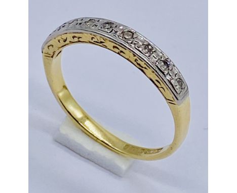 An 18ct gold half eternity ring set with diamonds, size N 1/2