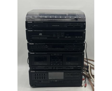 A vintage Phillips stacking hi-fi system, comprising of an FP772 auto return turntable, CD780 CD player, an FA773 amplifier, 