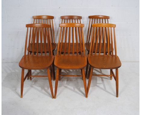 A set of six Ercol style stick-back chairs