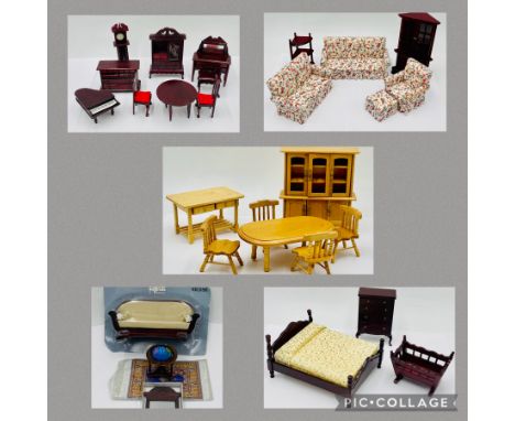 A collection of dolls house furniture including a floral three-piece suite, dining table and chairs, cot, corner cupboard, wa