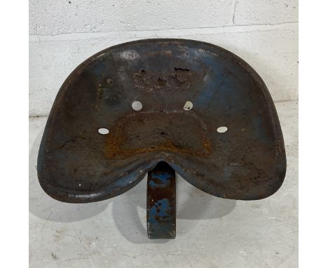 A vintage weathered tractor seat