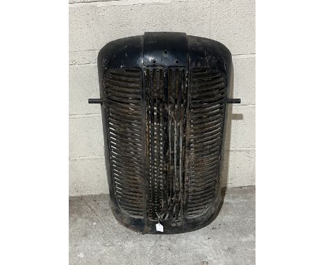 A vintage tractor grille (possibly a wheelhorse tractor ?)