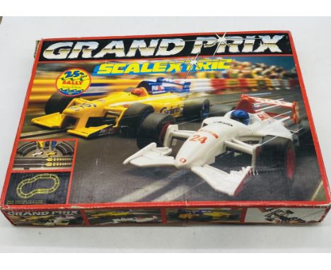 A vintage boxed Grand Prix Scalextric set (looks complete), along with a box of Scalextric accessories including track, contr