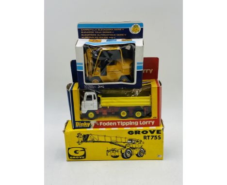 A boxed vintage Dinky Toys Foden Tipping Lorry (432), along with a die-cast Joal Caterpillar fork-lift and NZG Grove RT75S cr