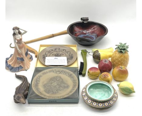 An assortment of ceramics including Poole Pottery. David Melville, Coalport, ceramic fruit etc along with a travel coat hange