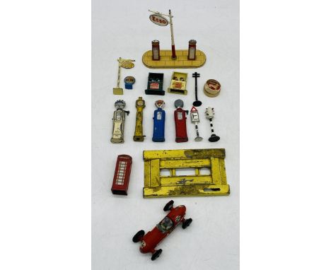 A collection of die-cast petrol pumps including Esso, along with a few road signs, traffic lights etc and Crescent Toy Ltd "G