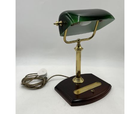 A modern banker's lamp with green shade and pen tray 