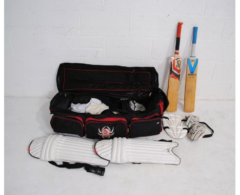 A collection of right handed cricketers gear, including two bats (one Kookaburra and one Slazenger), Slazenger pads, thigh gu