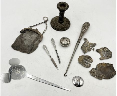 A collection of scrap silver (157.9g) along with an inscribed hallmarked silver Mickey Mouse paper knife (98.9g), three silve