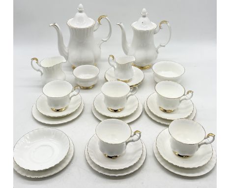 A Royal Albert Val D'or part tea service comprising of teapot, coffee pot, jugs, sugar bowl, five trios etc.