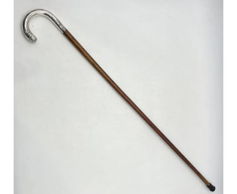 A turn of the century walking stick with continental silver handle 