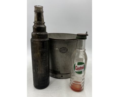 A galvanised Lister bucket along with a Castrol Motor Oil bottle and an Esso lube bottle. 