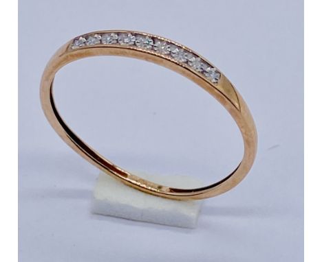 A 9ct gold diamond set half eternity ring, size N 1/2