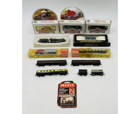 A collection of N gauge model railway locomotive, carriages and rolling stock including boxed Graham Farish BR diesel shunter