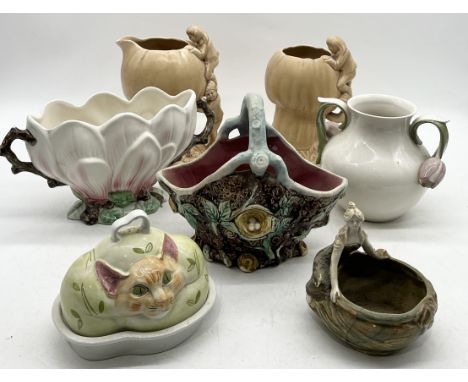 A collection of ceramics including Carlton Ware Cheshire cat butter dish, Sylvac vases, Majolica basket in the form of a bird