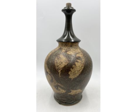 A pottery lamp base decorated with dragon motif 