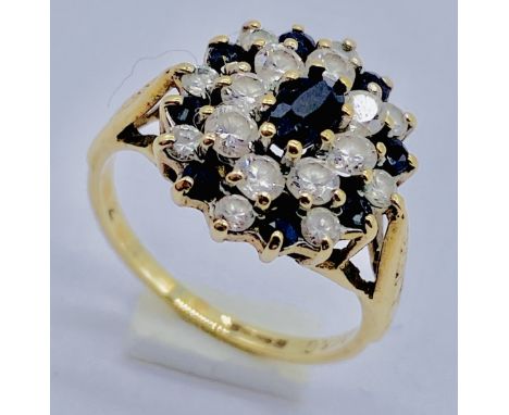 A 9ct gold ring set with sapphires and clear stones, size I 1/2