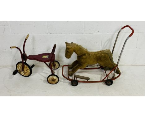 A vintage Lines Bros. (Ireland) Ltd child's push-a-long horse with metal frame, rubber wheels and body stuffed with wood wool