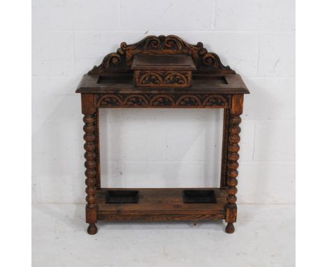 An antique oak hall stand, with storage compartment to top, with carved detailing and bobbin turned supports - length 76cm, d
