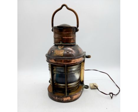 A vintage copper ship's lantern with makers label and converted to electricity - not tested. 