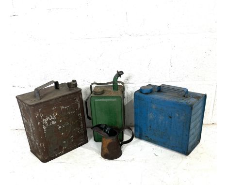 A collection of oil cans including B.P. Shellmex and Esso Blue Paraffin