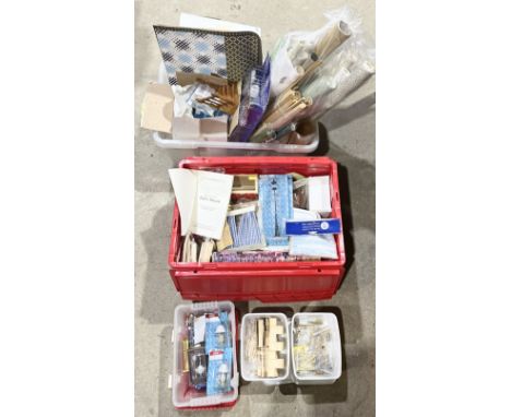 A large collection of dolls house accessories including fire places, street lamp, lamps, wall paper, windows, various lightin