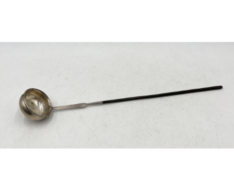 A Georgian unmarked silver toddy ladle