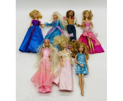 A collection of seven vintage Barbie dolls