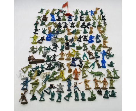 A collection of unpainted plastic toy model figures, mainly relating to the army