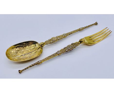 A silver gilt anointing spoon and matching fork, weight 68.8g, London 1910, Cornelius Desomeaux Saunders and James Francis Ho