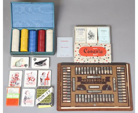 An Autobridge playing board; various playing card games; various coloured plastic gaming counters, cased; together with vario
