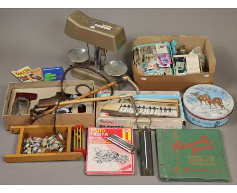 A Hohner “Super Chromonica”; together with two riding crops; five novelty Avon bottles; two advertising tins &amp; sundry oth